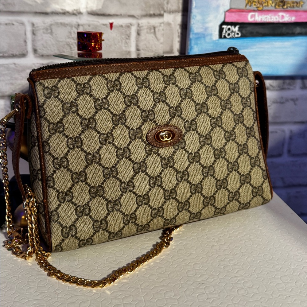 Gucci GG Supreme Coated Canvas Clutch with crossbody chain